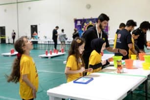 Students at a school robotics competition event