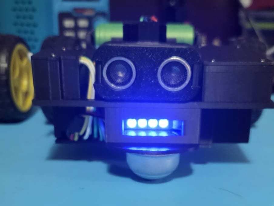 Spark Mini today: ultrasonic-sensor eyes and glowing LED mouth on a 3D-printed face